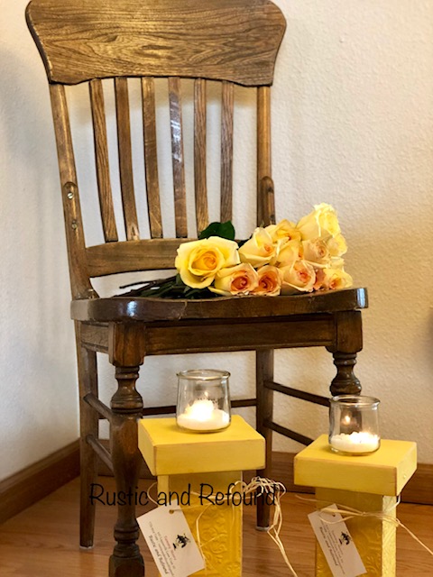 wooden chair w-yellow candle holders