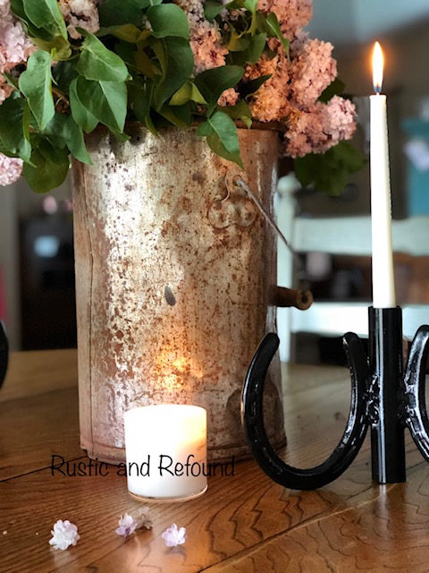  flickering candles with a my salvage style bucket of lilacs  6-18-19