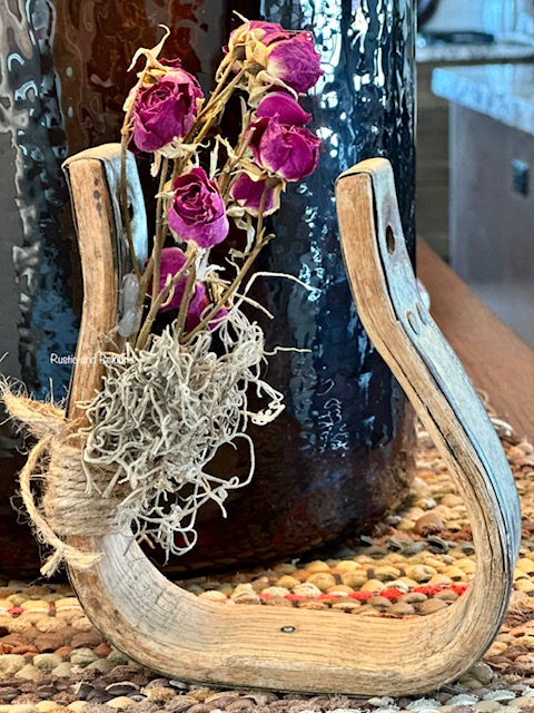 Western stirrup repurposed to hold flowers
