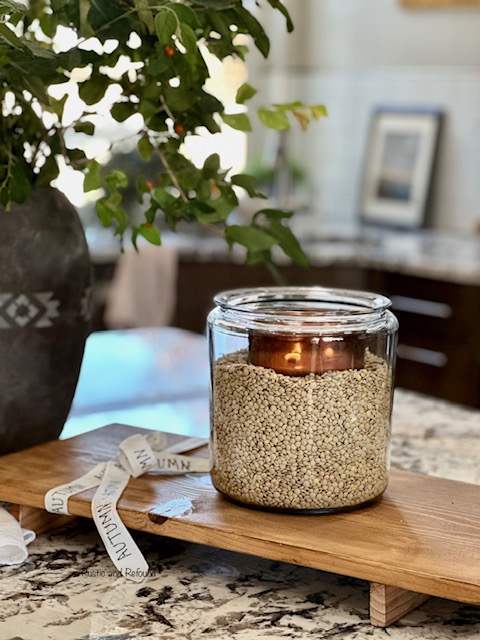 lentil jar and candle with greenery