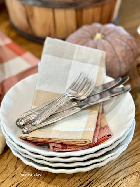 Ruffled edge bowls with plaid napkins and vintage silverware.